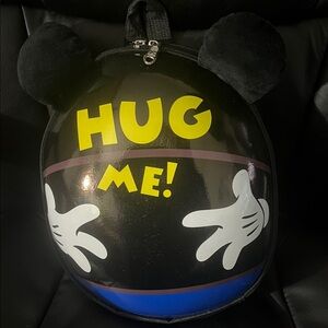Black Backpack with Yellow 'Hug Me' Design